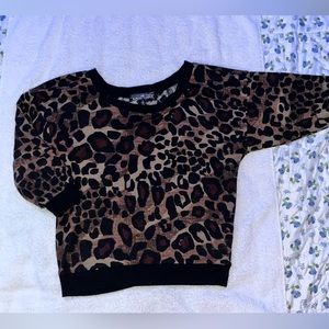 Cheetah top with a see-through back.